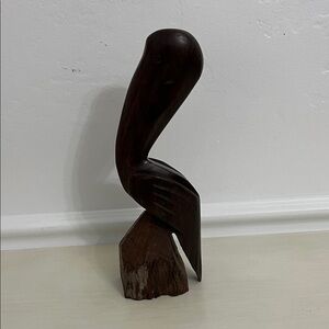 Iron wood pelican sculpture by hand